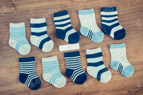Preview: Clothing For Newborn And Pregnancy Test Showing Positive Result, Concept Of Extending Family And