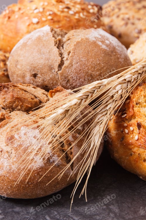 Preview: Fresh Baked Wholegrain Rolls Or Bread For Breakfast And Ears Of Rye Or Wheat Grain