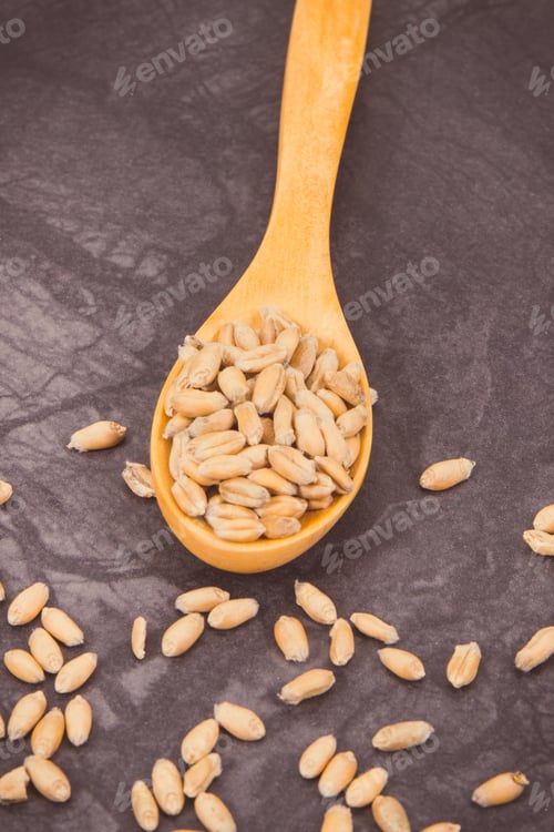 Preview: Rye Or Wheat Grains On Spoon, Agriculture And Harvest Concept. Vintage Photo