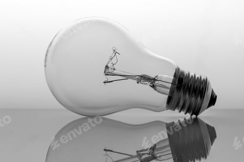 Preview: Old Bulb Filament Isolated Backlit On White Background, Conceptual Image