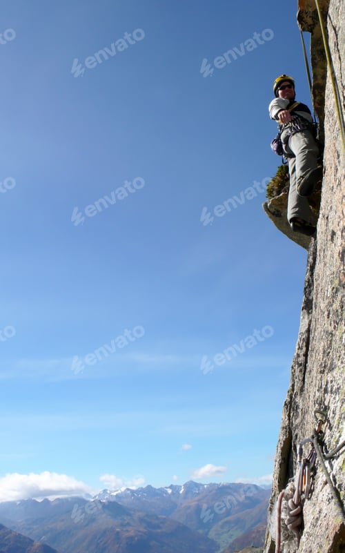 Preview: Mountain Guide Rock Climber On A Steep Granite Route In The Alps Of Switzerland On A Beautiful Day