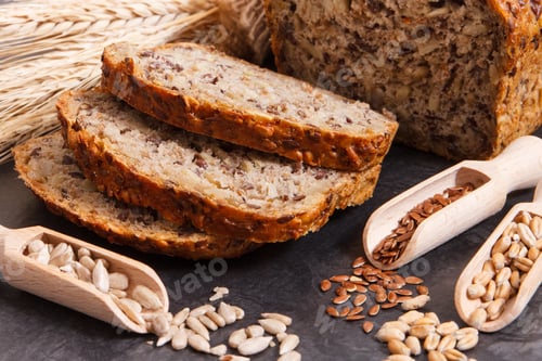 Preview: Fresh Baked Wholegrain Bread With Ingredients For Baking And Ears Of Rye Or Wheat Grain