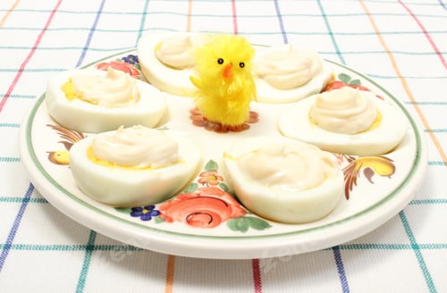 Preview: Halves Of Eggs With Mayonnaise And Yellow Easter Chicken Lying On Colorful Plate, Sliced Egg On