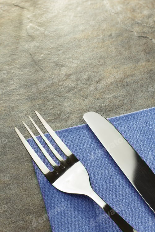Preview: Knife And Fork On Napkin Cloth
