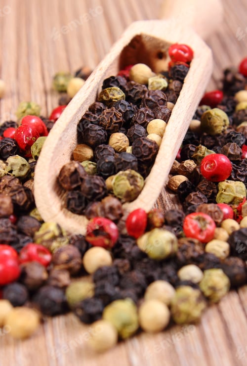 Preview: Heap Of Fresh Colored Pepper With Wooden Spoon Lying On Wooden Table, Seasoning For Cooking