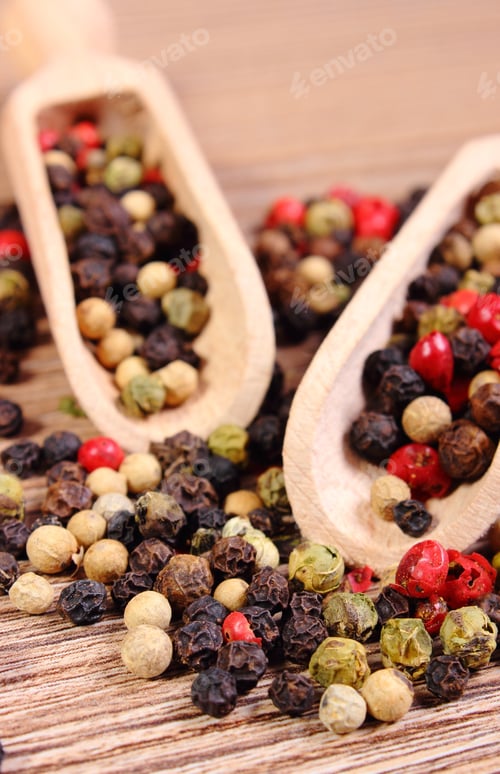 Preview: Heap Of Fresh Colored Pepper With Wooden Spoon Lying On Wooden Table, Seasoning For Cooking