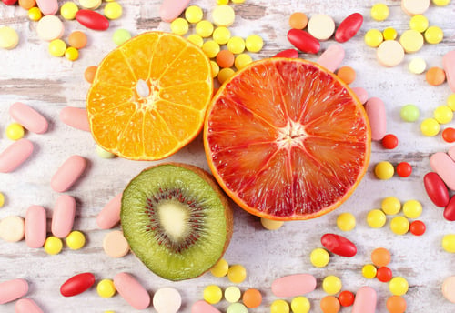 Preview: Fresh Natural Fruits And Medical Pills, Tablets And Capsules On Rustic Wooden Background, Choice