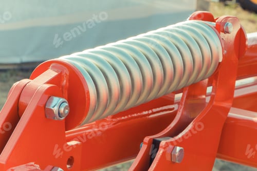 Preview: Steel Spring In Industrial Or Agricultural Machinery. Part Of Hydraulic Or Pneumatic Equipments
