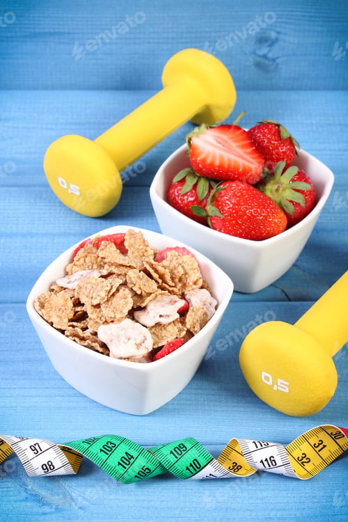 Preview: Fresh Ripe Strawberries With Wheat And Rye Flakes, Dumbbells For Fitness And Tape Measure, Concept