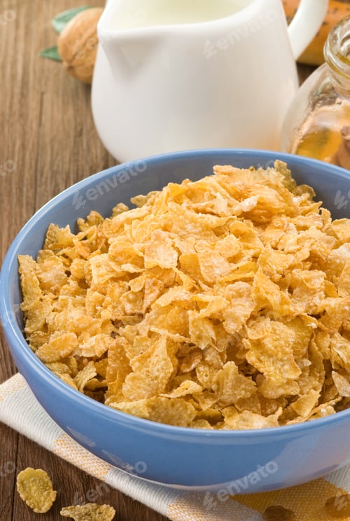 Preview: Bowl Of Corn Flakes And Milk On Wood Background