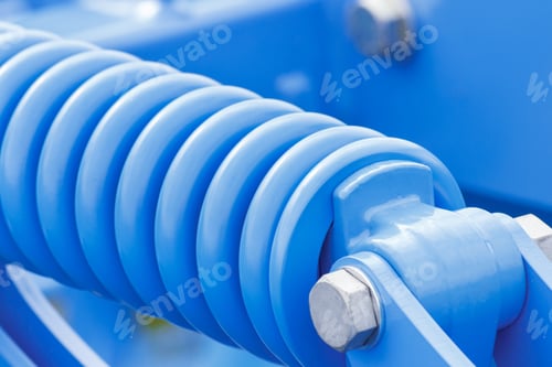 Preview: Steel Spring As Detail Of Blue Industrial Or Agricultural Machinery, Part Of Hydraulic Or Pneumatic