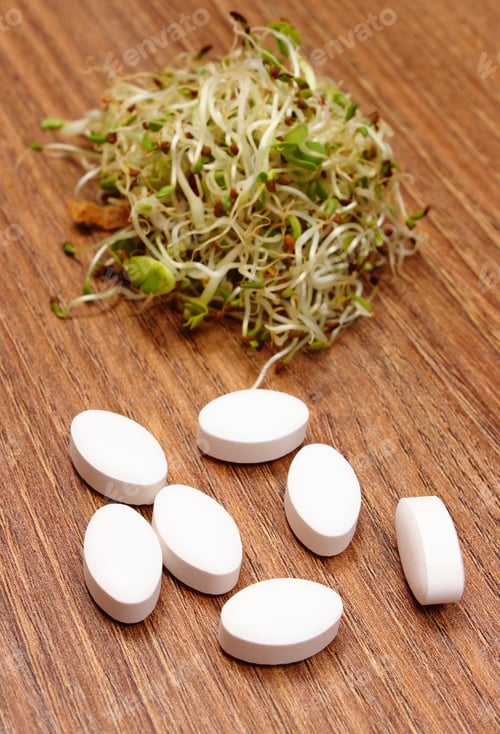 Preview: Tablets Supplements With Alfalfa And Radish Sprouts On Wooden Surface, Choice Between Healthy
