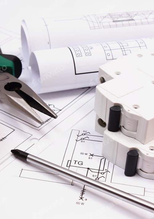 Preview: Metal Pliers, Screwdriver, Electric Fuse And Rolls Of Diagrams On Electrical Construction Drawing