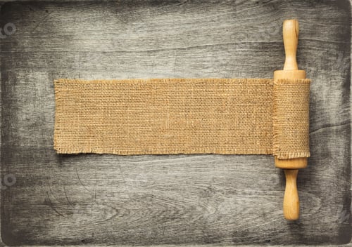 Preview: Rolling Pin At Old Wooden Table, Top View