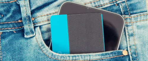 Preview: Credit Card And Mobile Phone For Cashless Paying In Pocket Of Blue Jeans. Finance And Banking