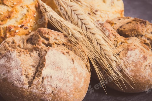 Preview: Fresh Wholegrain Rolls With Seeds And Ears Of Rye Or Wheat Grain. Vintage Photo