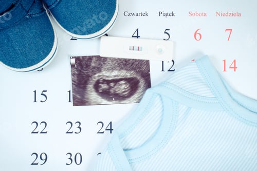 Preview: Pregnancy Test With Positive Result, Ultrasound Scan Of Baby And Clothing For Newborn On Calendar
