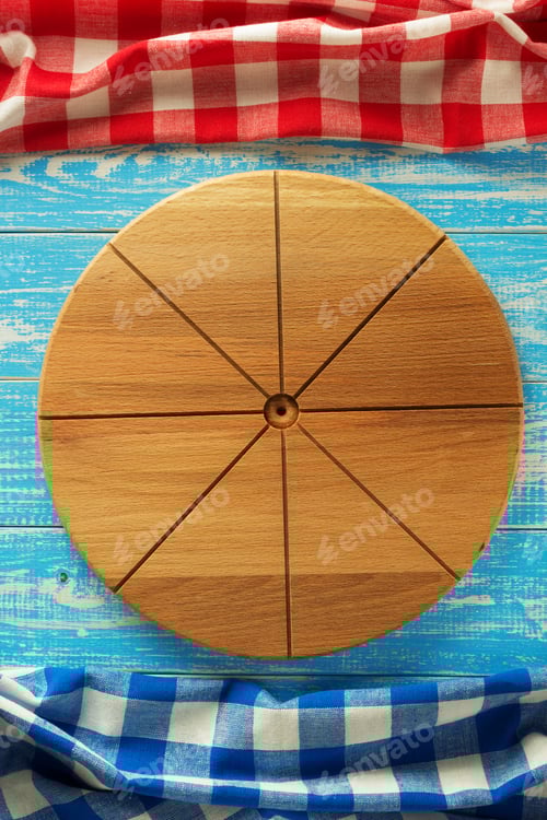 Preview: Round Cutting Board With Checkered Napkins on Table
