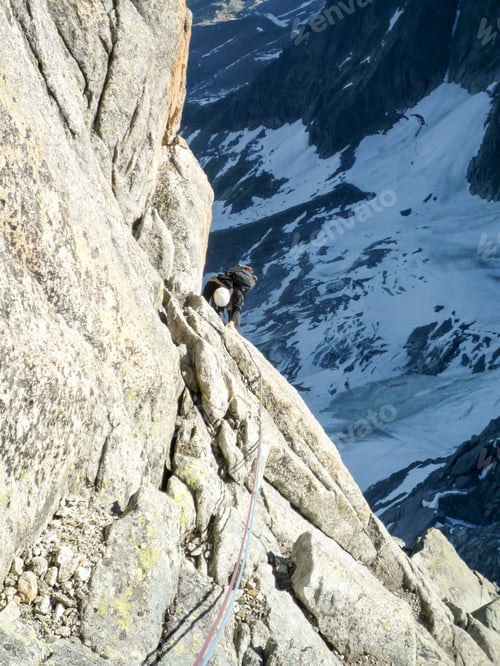 Preview: Mountain Climber On A Steep Climbing Route In The French Alps In Chamonix