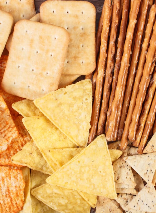 Preview: Heap Of Crunchy Potato Crisps, Breadsticks And Cookies, Concept Of Restriction Eating Unhealthy And