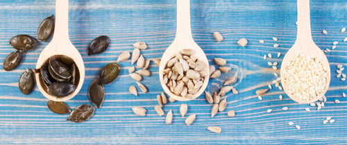 Preview: Sunflower, Pumpkin And Sesame Seeds With Wooden Spoon On Boards, Concept Of Healthy Nutrition