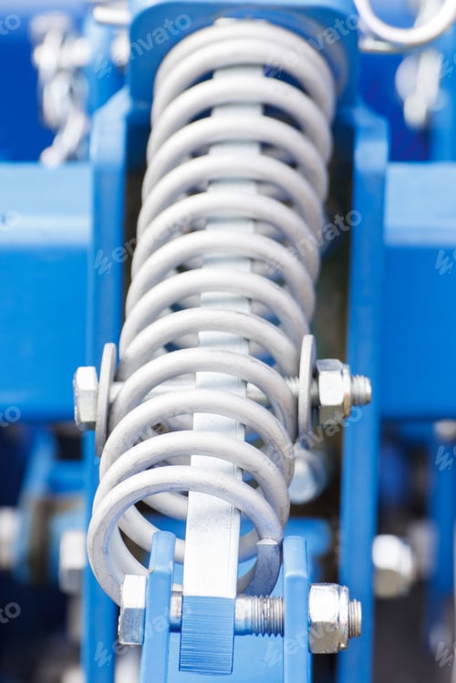 Preview: Steel Spring As Detail Of Blue Industrial Or Agricultural Machinery, Part Of Hydraulic Or Pneumatic