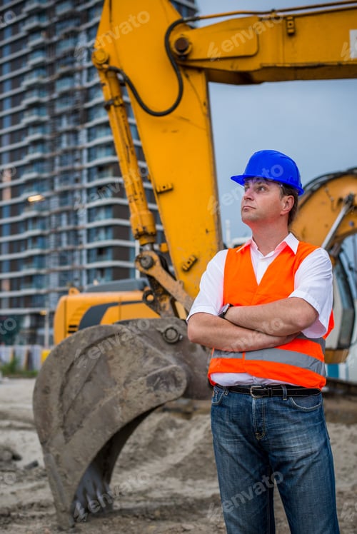 Preview: Engineer In Front Of Excavator On A Construction Site