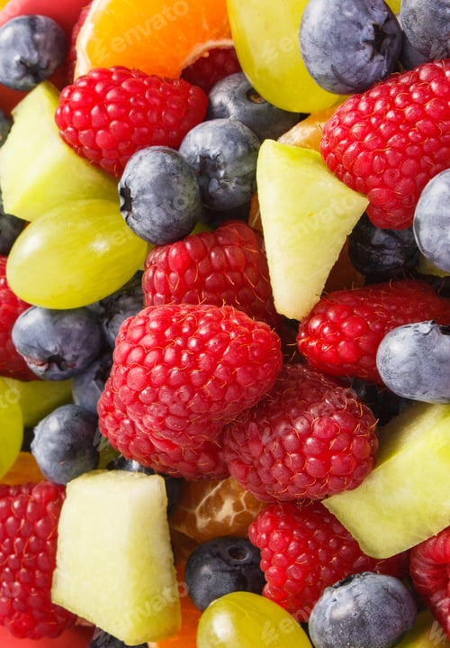 Preview: Fresh Fruit Salad With Raspberries, Melon, Mandarine, Grapes And Blueberries, Concept Of Diet