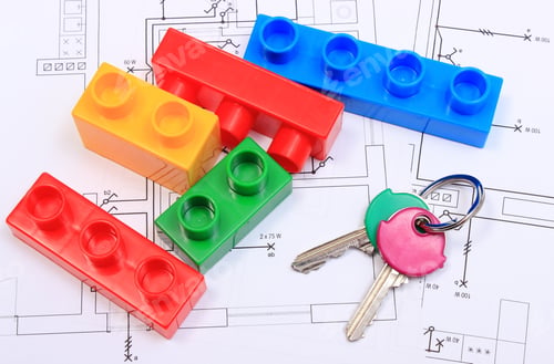 Preview: Closeup Of Home Keys And Heap Of Plastic Colorful Building Blocks Lying On Construction Drawing Of