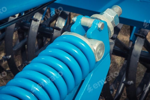 Preview: Hard Blue Spring Made Of Steel. Part And Detail Of Industrial Or Agricultural Machine. Technology