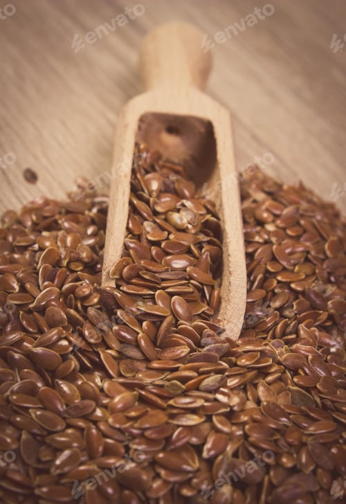 Preview: Vintage Photo Of Brown Linseed, Flax Seeds With Wooden Spoon On Wooden Background, Concept For