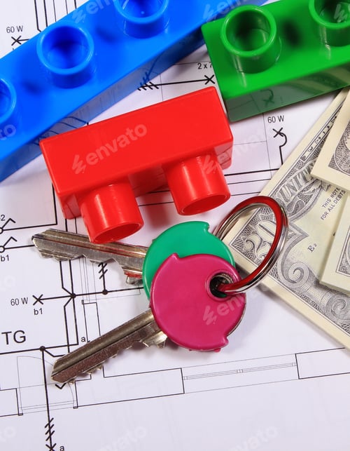 Preview: Heap Of Banknotes, Home Keys And Plastic Colorful Building Blocks Lying On Construction Drawing Of