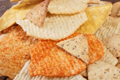 Preview: Heap Of Crunchy Salted Potato Crisps And Cookies On Rustic Board, Concept Of Restriction Eating