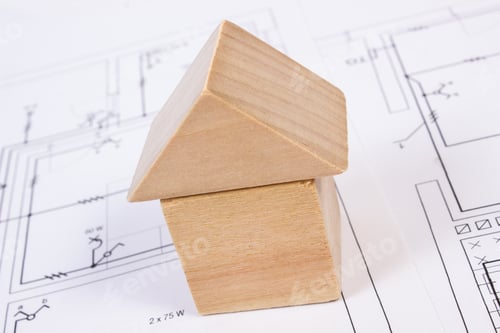 Preview: House Shape Made Of Wooden Blocks Lying On Electrical Construction Drawings Of House, Concept Of
