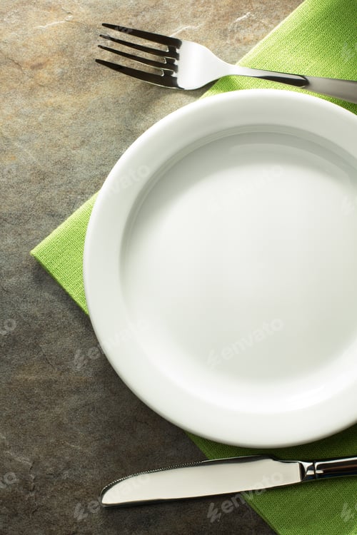Preview: Plate, Knife And Fork On Table Background