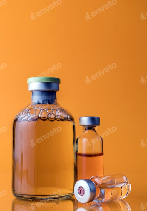 Preview: Several Vials And Syringe In Laboratory, Conceptual Image, Isolated On Orange Background