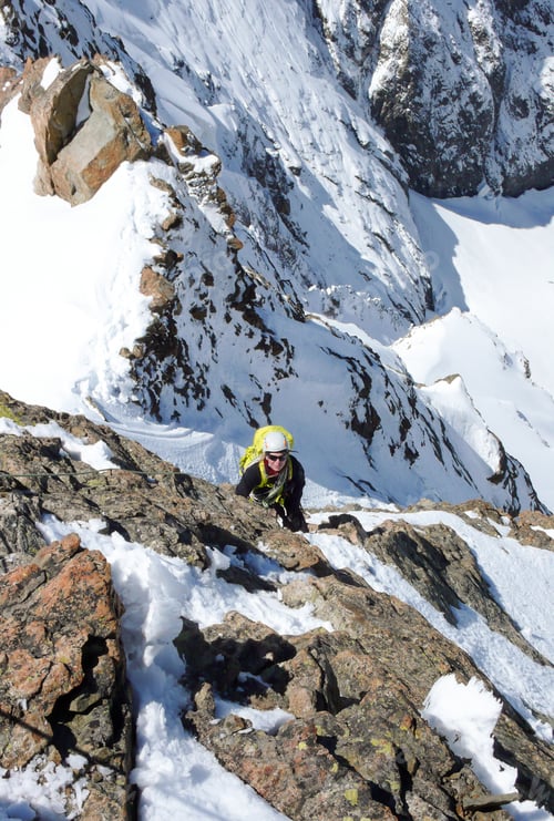 Preview: Female Mountain Climber On A Steep Route To A High Mountain Peak In The Swiss Alps Above Grindelwald