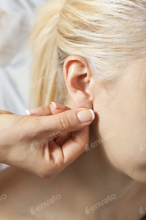 Preview: Therapist Doing Massage On A Woman'S Ear