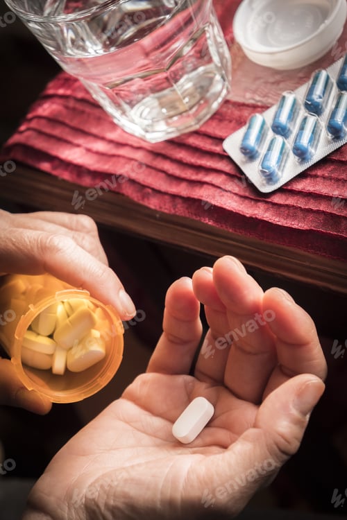 Preview: Women Take White Capsule With Left Hand From A Ambar Bottle
