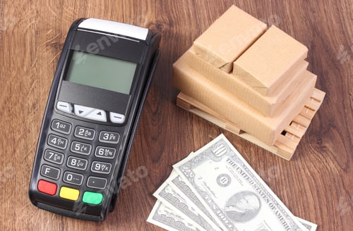 Preview: Payment Terminal, Currencies Dollar And Small Wrapped Boxes On Wooden Pallet, Concept Of Paying For