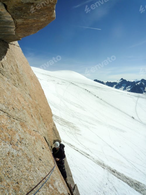 Aperçu: Male Rock Climber On The A Steep Vertical Granite Rebuffat Rock Climbing Route On Theaiguille Du