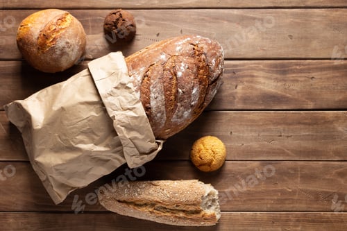 Preview: Loaf Of Fresh Bread And Buns On Wooden Table. Assortment Of Bakery Food At Wood Plank Board