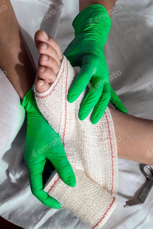 Preview: Close-Up Of A Nurse Tying Bandage On Patient'S Foot