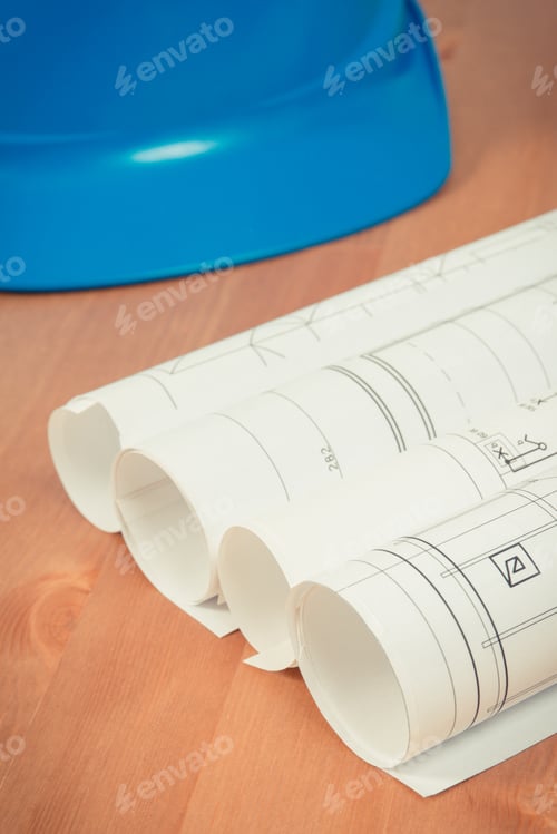 Preview: Rolls Of Diagrams Or Electrical Construction Drawings And Protective Helmet For Engineer Jobs