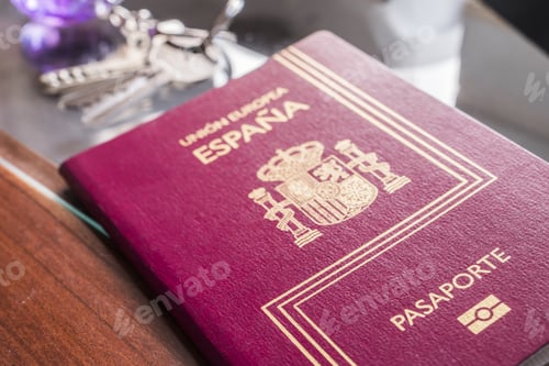 Preview: Spanish Passport Next To Keys And Clock On A Table