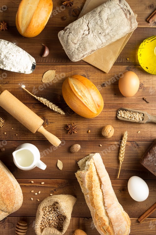 Preview: Bread And Bakery Ingredients On Wooden Table Background, Top View