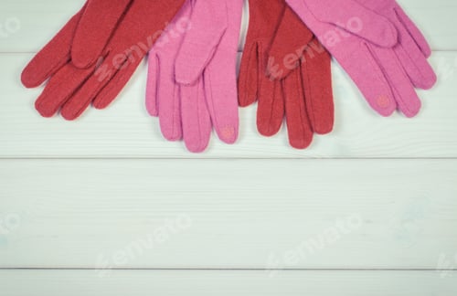 Preview: Woolen Gloves For Woman On White Boards, Warm Clothing For Autumn Or Winter, Copy Space For Text