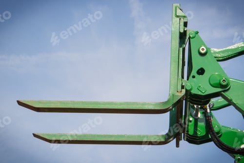 Preview: Part And Detail Of Old Forklift Loader Or Stacker On Blue Sky Background. Modern Technology