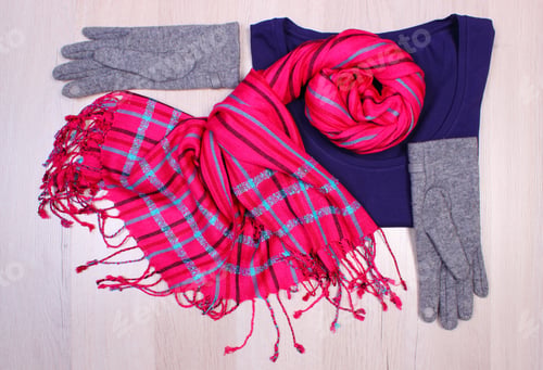 Preview: Womanly Clothes On Wooden Surface Plank, Gloves, Sweater And Shawl Or Scarf, Warm Clothing For