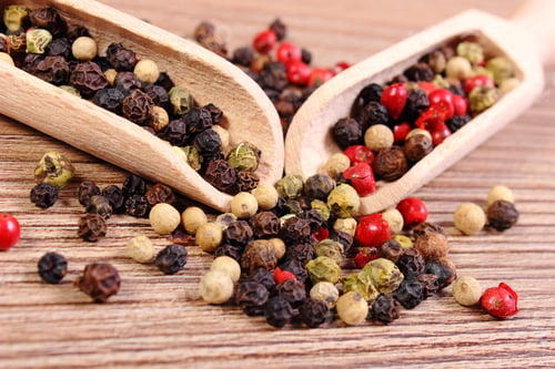 Preview: Heap Of Fresh Colored Pepper With Wooden Spoon Lying On Wooden Table, Seasoning For Cooking